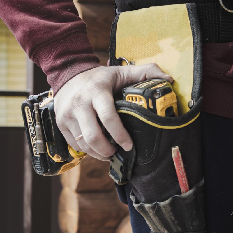 repairman carrying tools