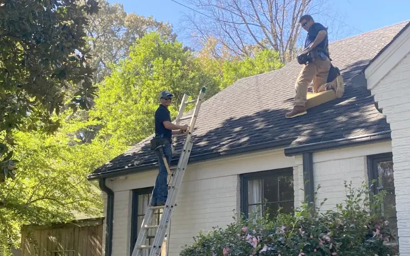 Crewpros inspecting roof before repairs.