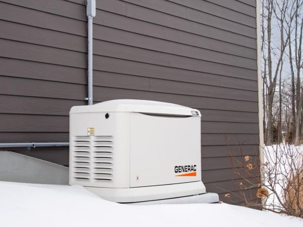 Generac home generator in the snow.